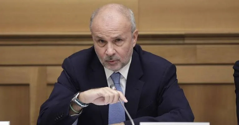 Orazio Schillaci speaking into a microphone in a wood-panelled hearing room
